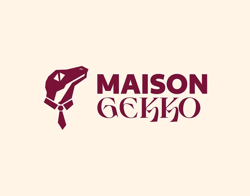 Maison Gekko : Un gecko géométrique, un mot-symbole et un contraste bordeaux sur fond clair. Une identité visuelle présentée avec ses déclinaisons.
